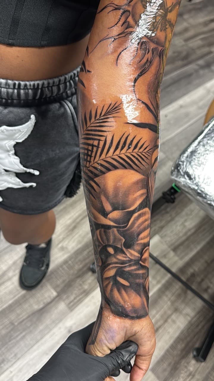 Black & Grey + Floral palm leaves tattoo on Half Sleeve by Inkheadz on TattMe
