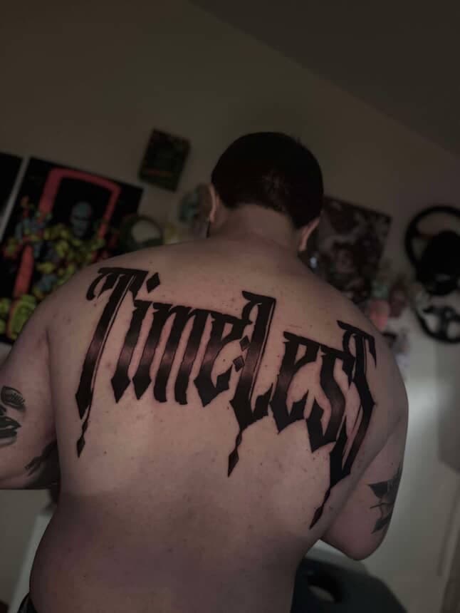 Lettering + Script timeless tattoo on Upper Back by LEGENDARY_HANDZ on TattMe