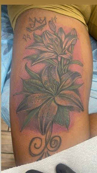 Floral + Color lilies tattoo on Thigh by Chris on TattMe