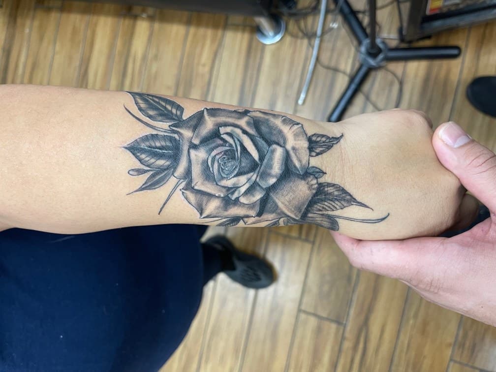 Black & Grey + Floral rose tattoo on Forearm by Chris on TattMe