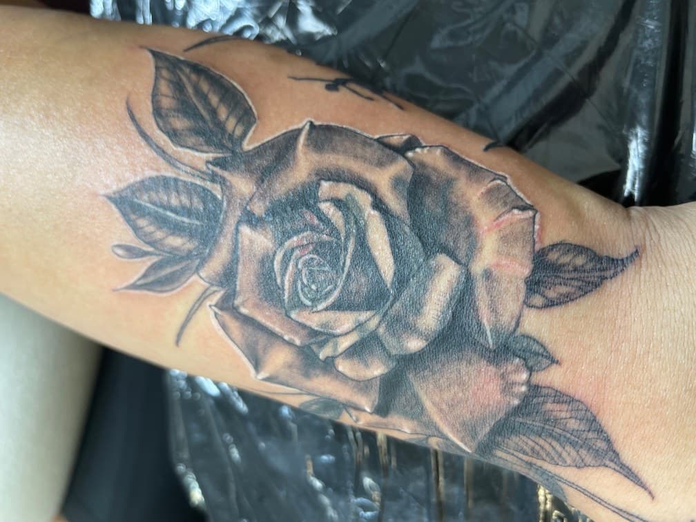 Black & Grey + Floral rose tattoo on Forearm by Chris on TattMe