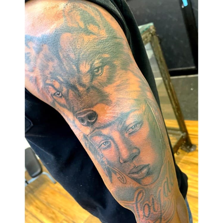 Black & Grey + Realism wolf tattoo on Upper Arm by Chris on TattMe