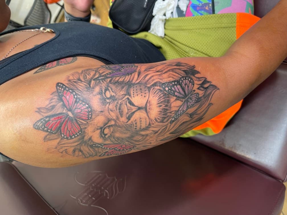 Realism + Black & Grey lion tattoo on Upper Arm by Chris on TattMe