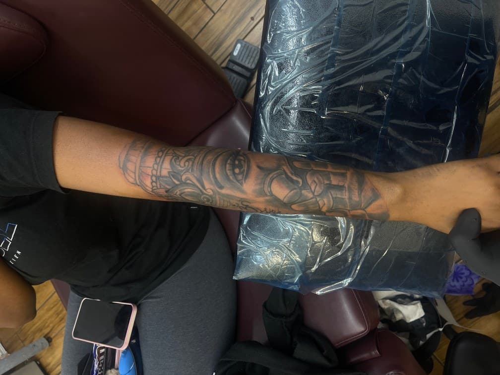 Black & Grey + Illustrative deity tattoo on Forearm by Chris on TattMe