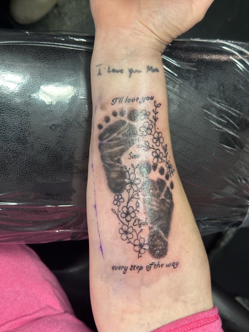 Black & Grey + Floral baby footprints tattoo on Forearm by Tattoos_by_Haylee on TattMe