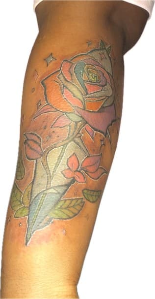 Color + Illustrative rose tattoo on Upper Arm by Ariesinkedme on TattMe