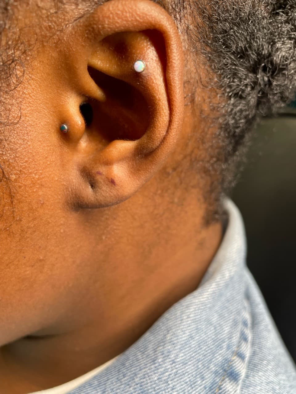 ear tattoo on Face by Ariesinkedme on TattMe