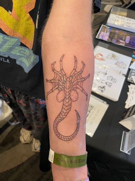 Line-work + Illustrative facehugger tattoo on Forearm by Ariesinkedme on TattMe