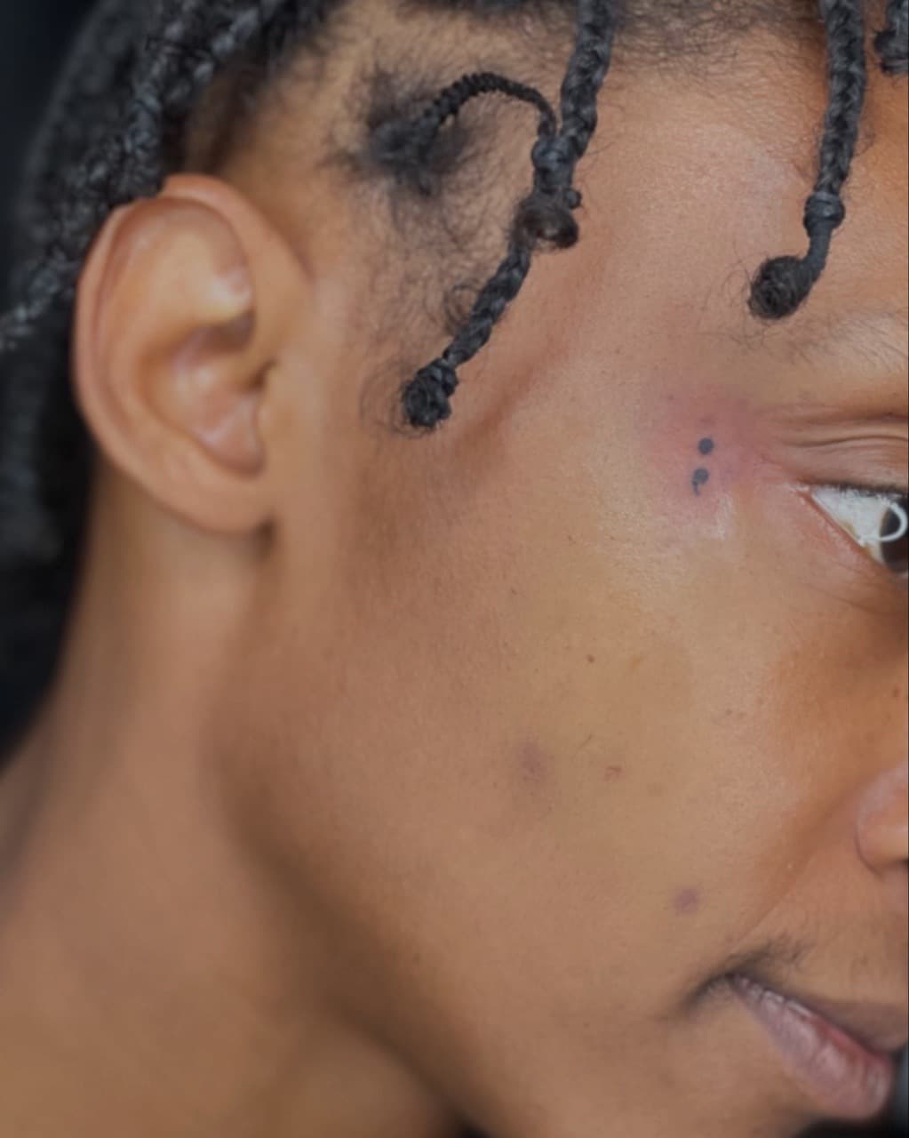 Minimalist + Black-work semicolon tattoo on Face by Ariesinkedme on TattMe