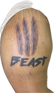 Black & Grey + Lettering claw marks tattoo on Upper Arm by Ariesinkedme on TattMe