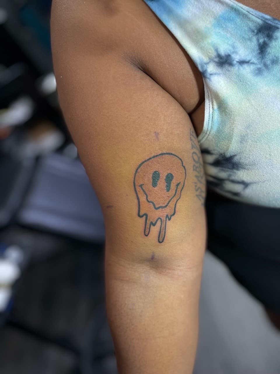 Cartoon + Abstract smiley face tattoo on Upper Arm by Ariesinkedme on TattMe