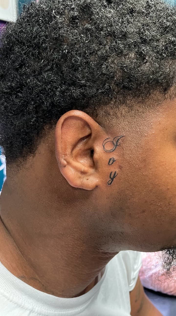 Lettering + Script joy tattoo on Face by Ariesinkedme on TattMe