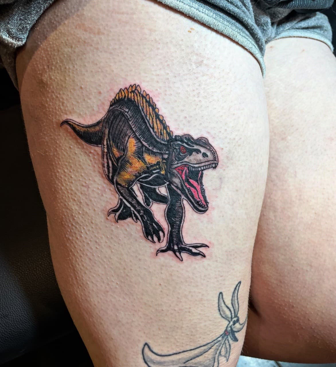 Color + Illustrative dinosaur tattoo on Thigh by Ariesinkedme on TattMe