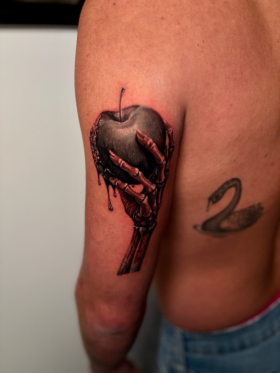 Black & Grey + Realism skeleton hand tattoo on Upper Arm by Damionjonestattoos on TattMe