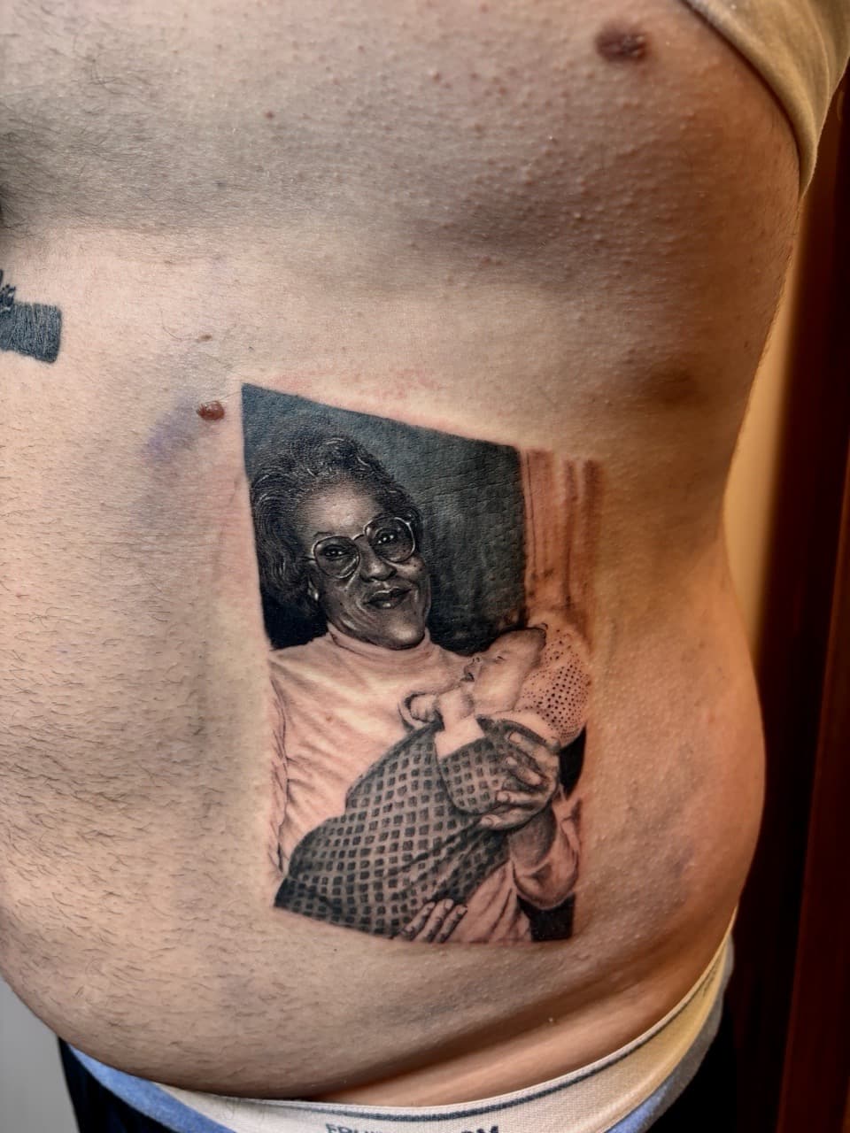 Realism + Black & Grey woman tattoo on Ribs by Damionjonestattoos on TattMe