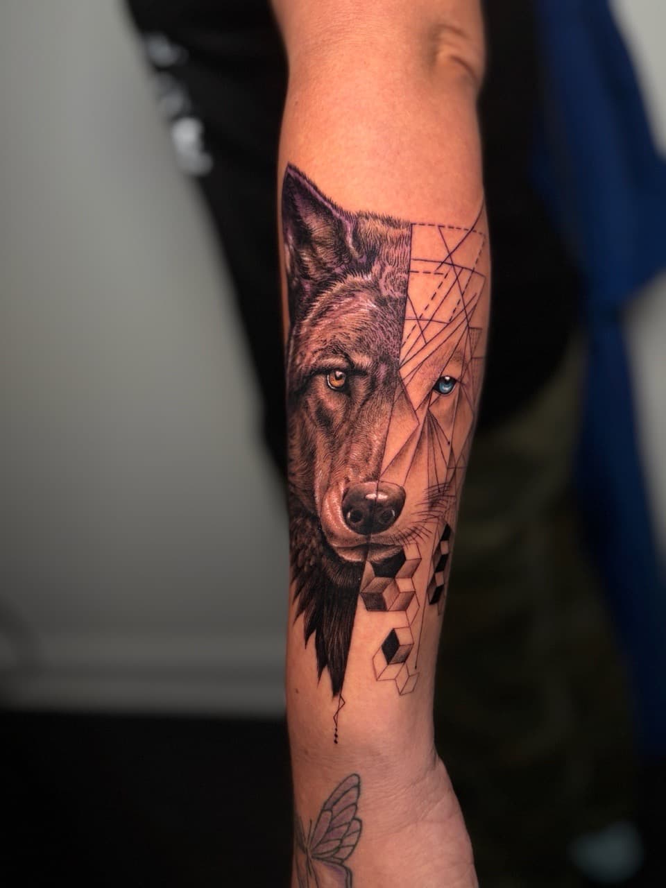 Realism + Geometric wolf tattoo on Forearm by Damionjonestattoos on TattMe