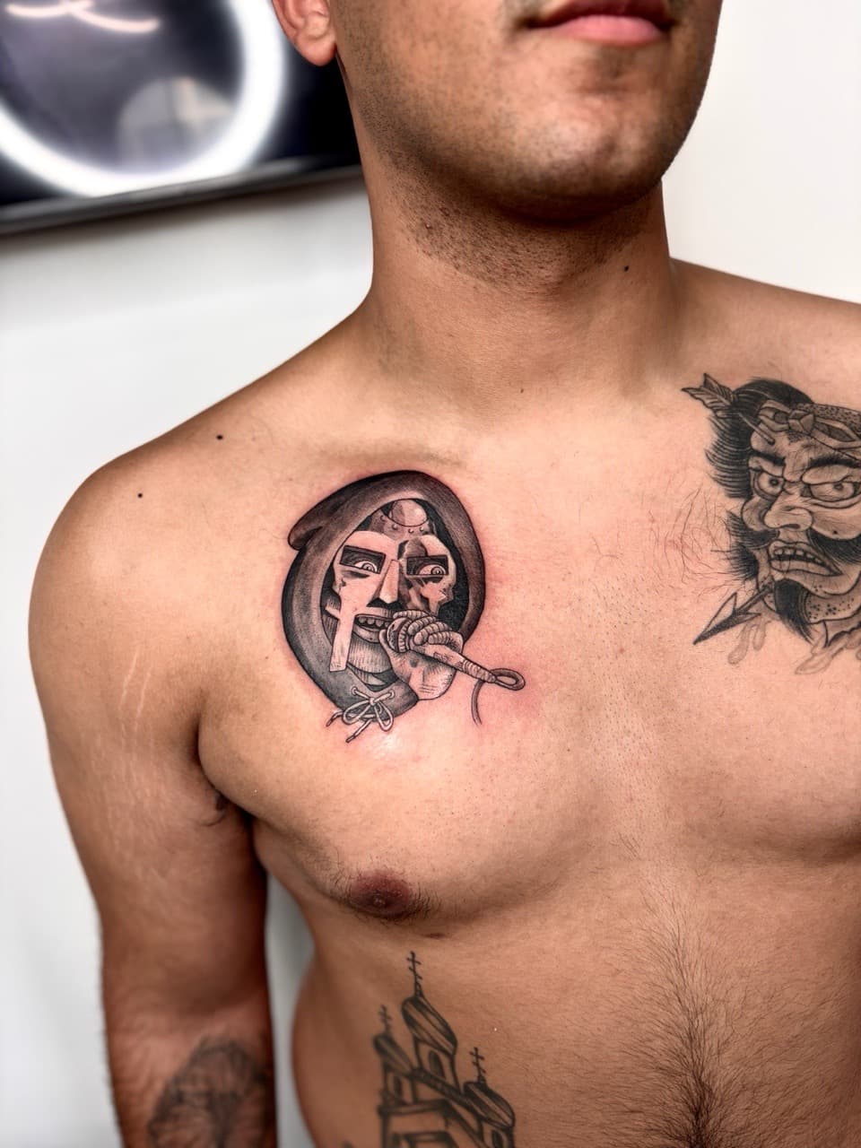 Black & Grey + Illustrative mf doom tattoo on Chest by Damionjonestattoos on TattMe