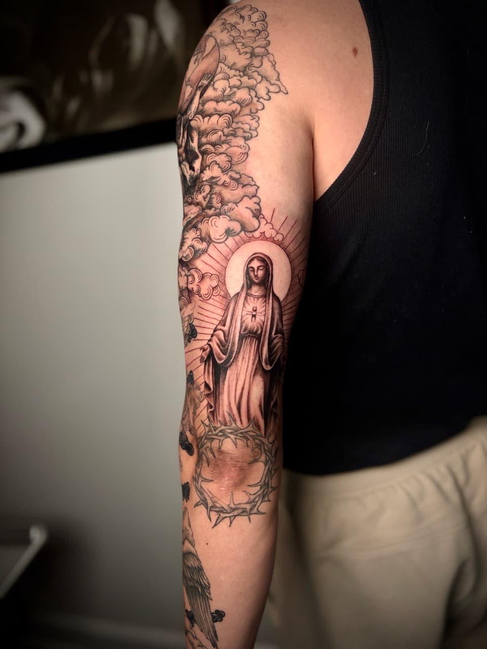 Black & Grey + Illustrative virgin mary tattoo on Upper Arm by Damionjonestattoos on TattMe