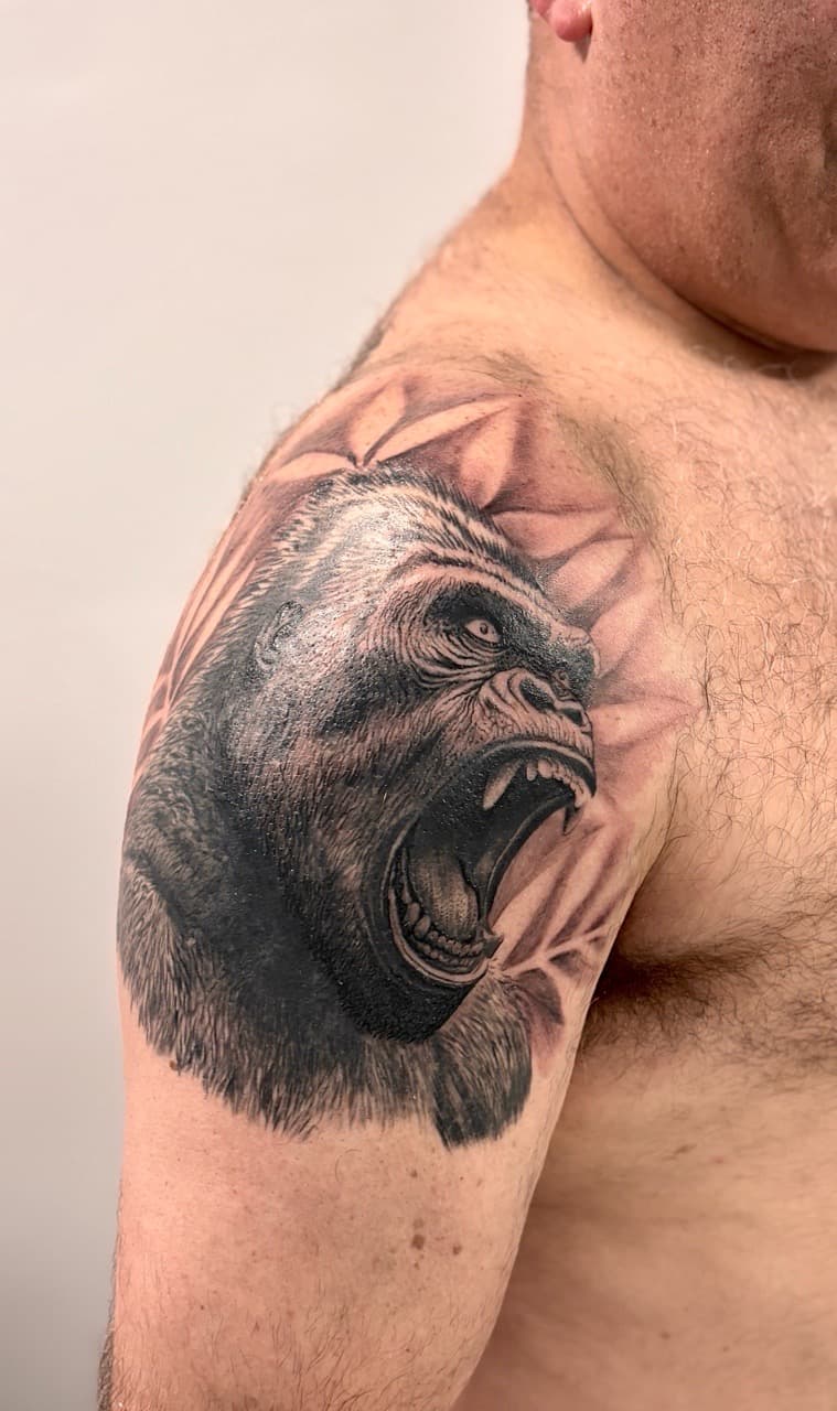 Realism + Black & Grey gorilla tattoo on Shoulder by Damionjonestattoos on TattMe