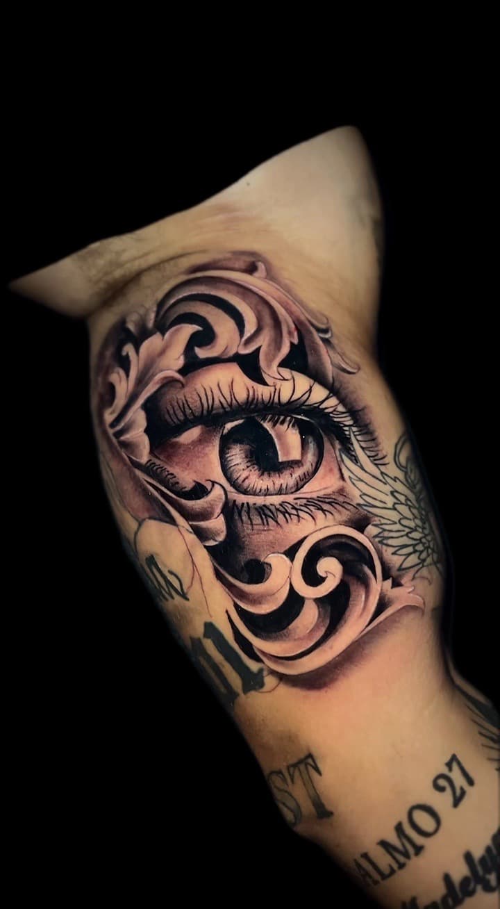 Black & Grey + Realism eye tattoo on Upper Arm by Santos_inkz on TattMe