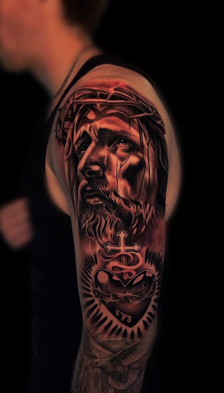 Realism + Black & Grey jesus tattoo on Upper Arm by Santos_inkz on TattMe