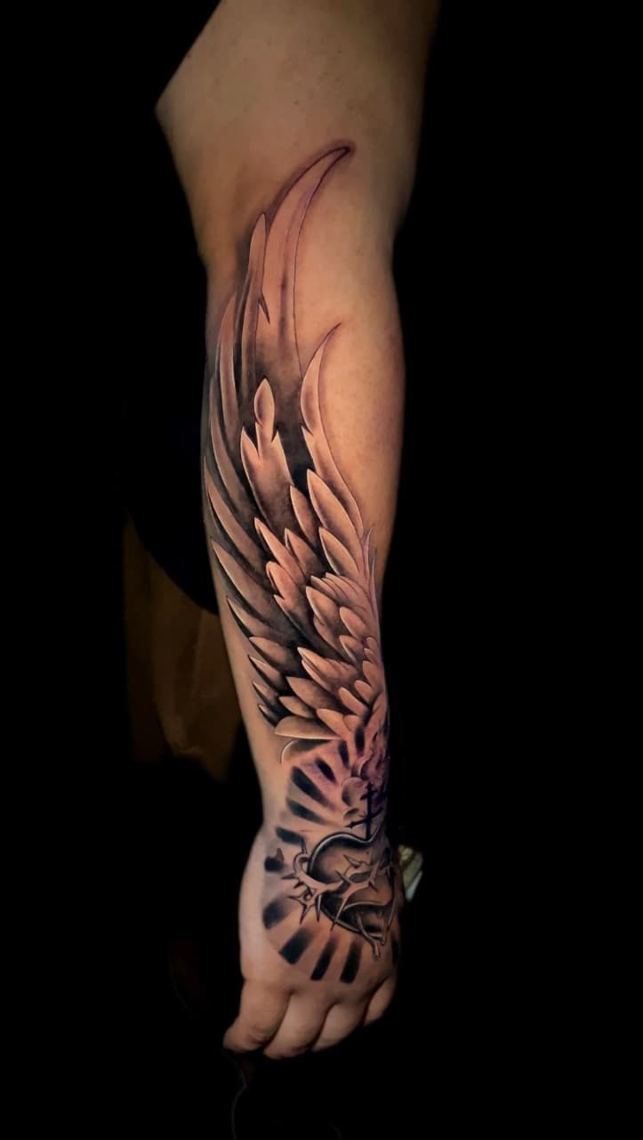 Black & Grey + Realism wings tattoo on Forearm by Santos_inkz on TattMe
