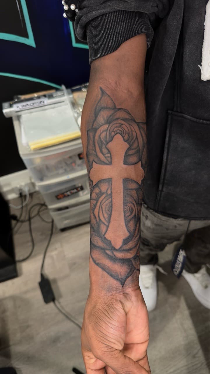Black & Grey + Floral cross tattoo on Forearm by yeahdatscjink on TattMe