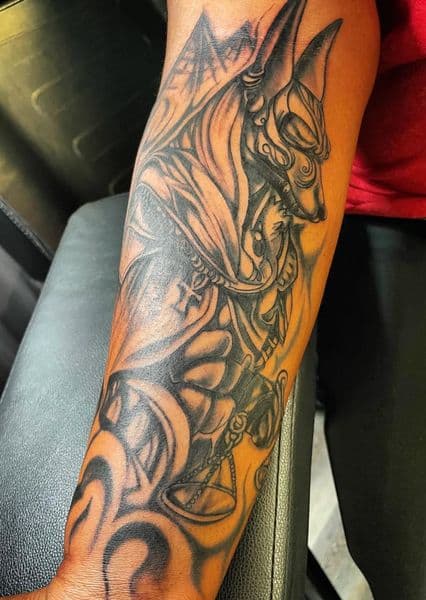 Black & Grey + Illustrative anubis tattoo on Forearm by IndigoInk on TattMe