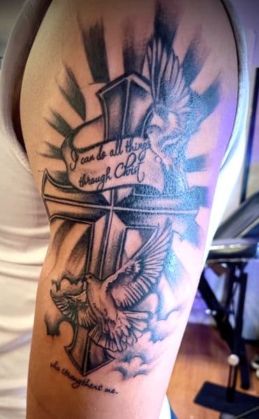 Black & Grey + Illustrative cross tattoo on Upper Arm by IndigoInk on TattMe
