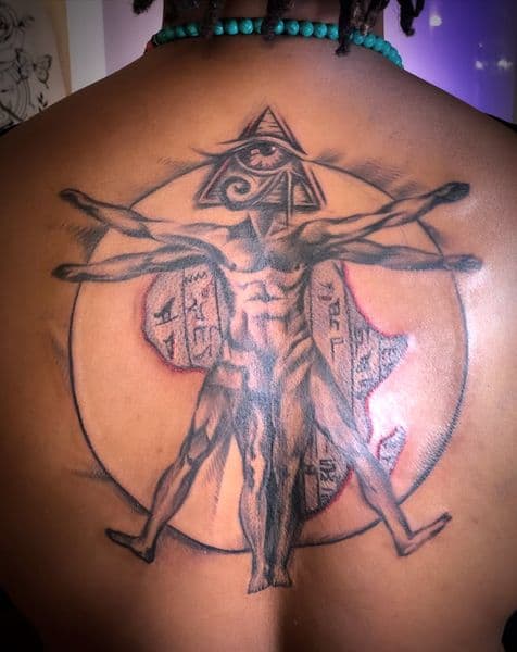 Black & Grey + Illustrative vitruvian man tattoo on Upper Back by IndigoInk on TattMe