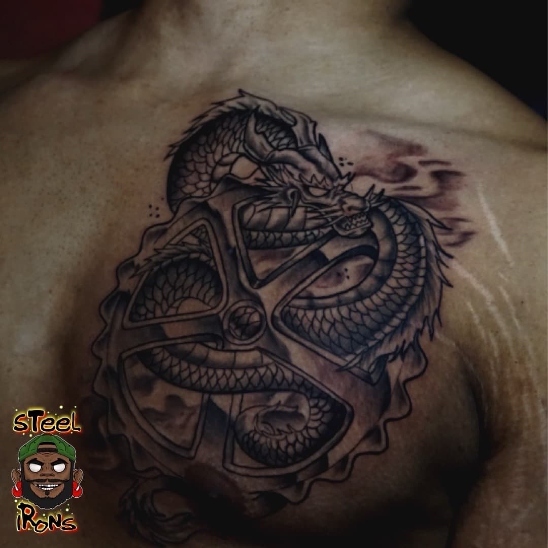 Black & Grey + Illustrative dragon tattoo on Chest by Steelirons on TattMe