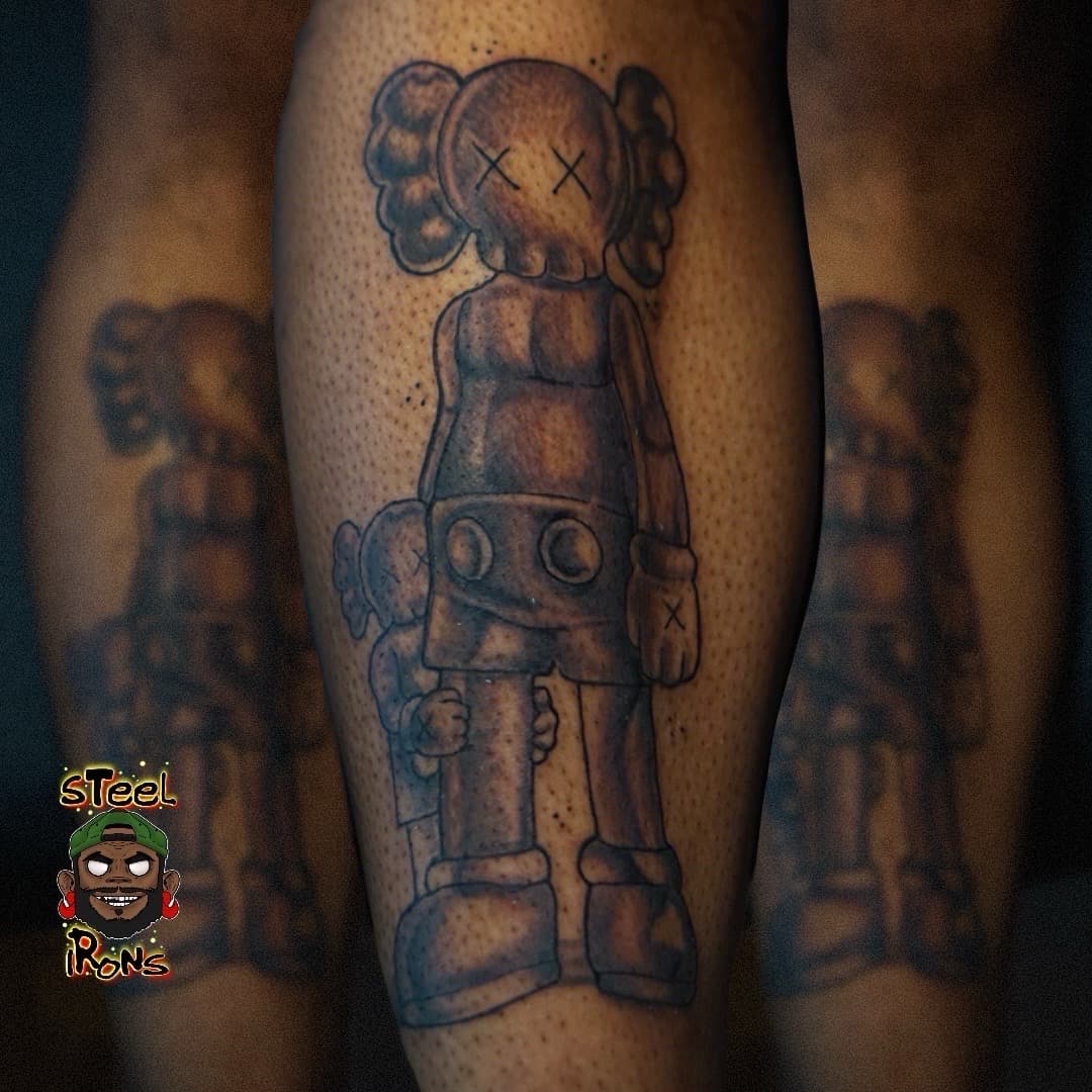 Black & Grey + Pop Culture kaws tattoo on Calf by Steelirons on TattMe