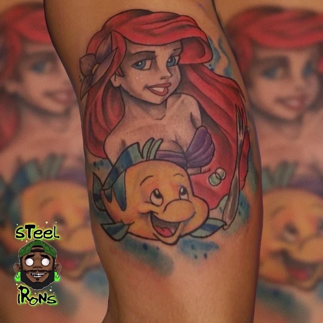 Cartoon + Color ariel tattoo on Upper Arm by Steelirons on TattMe