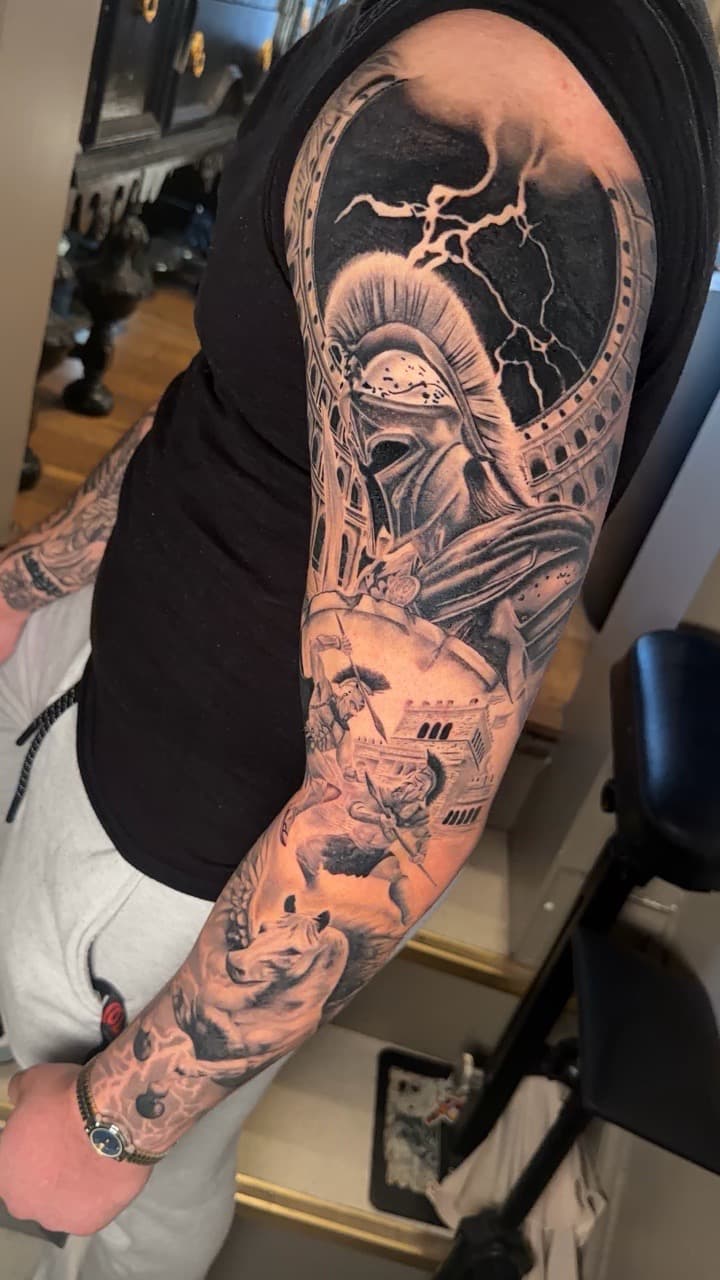 Black & Grey + Realism spartan tattoo on Full Sleeve by Noticeink on TattMe