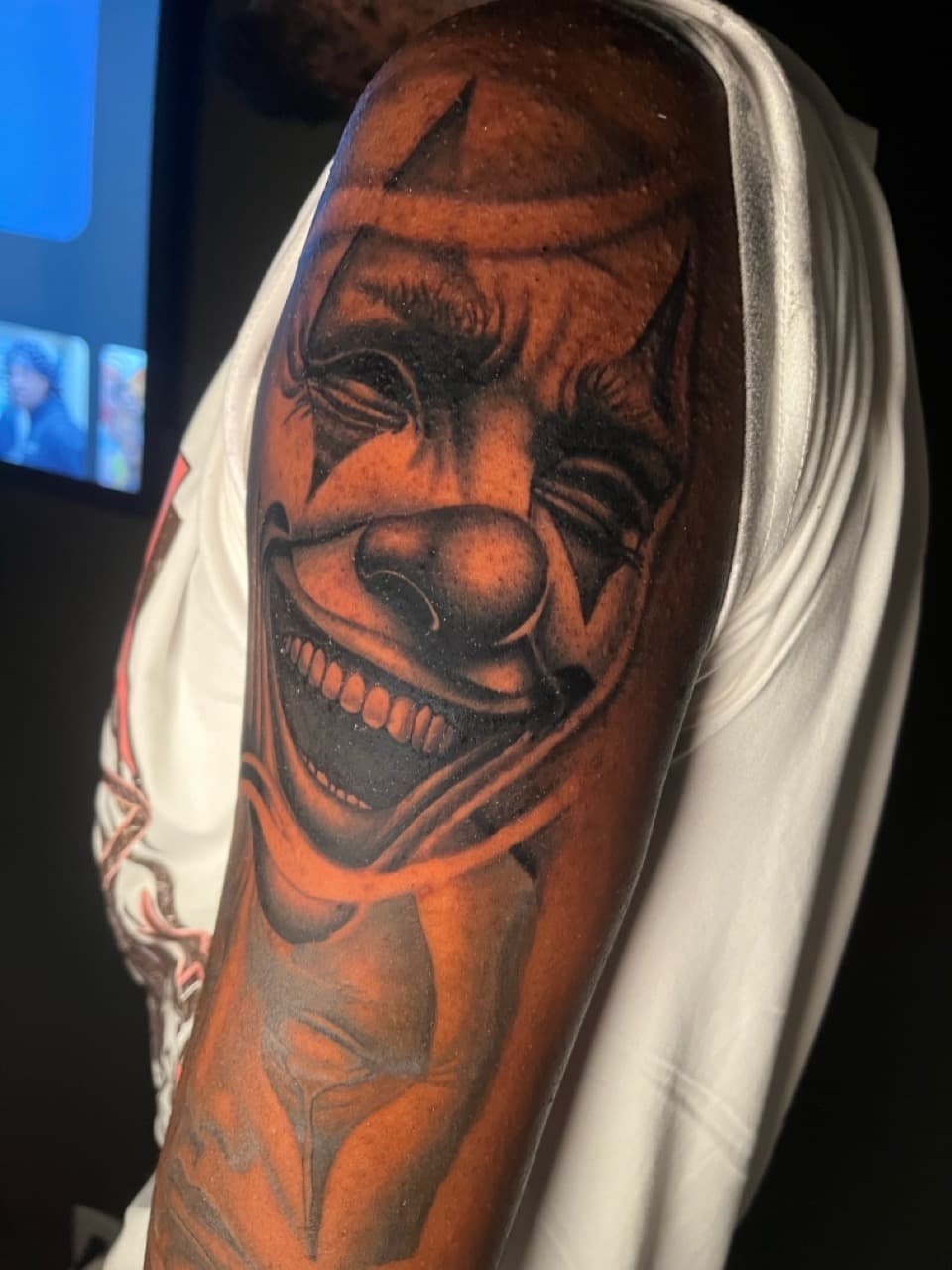 Black & Grey + Realism clown tattoo on Upper Arm by Noticeink on TattMe