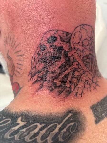 Black & Grey + Illustrative skulls tattoo on Neck (Back) by Skull_Brothers_Ink on TattMe