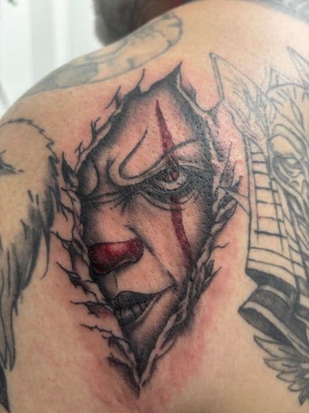 Realism + Black & Grey clown tattoo on Shoulder Blade by Skull_Brothers_Ink on TattMe