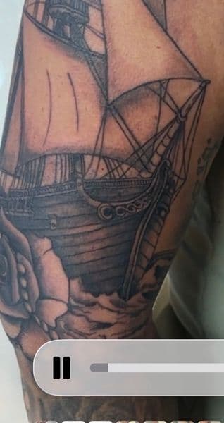 Black & Grey + Illustrative ship tattoo on Upper Arm by Skull_Brothers_Ink on TattMe