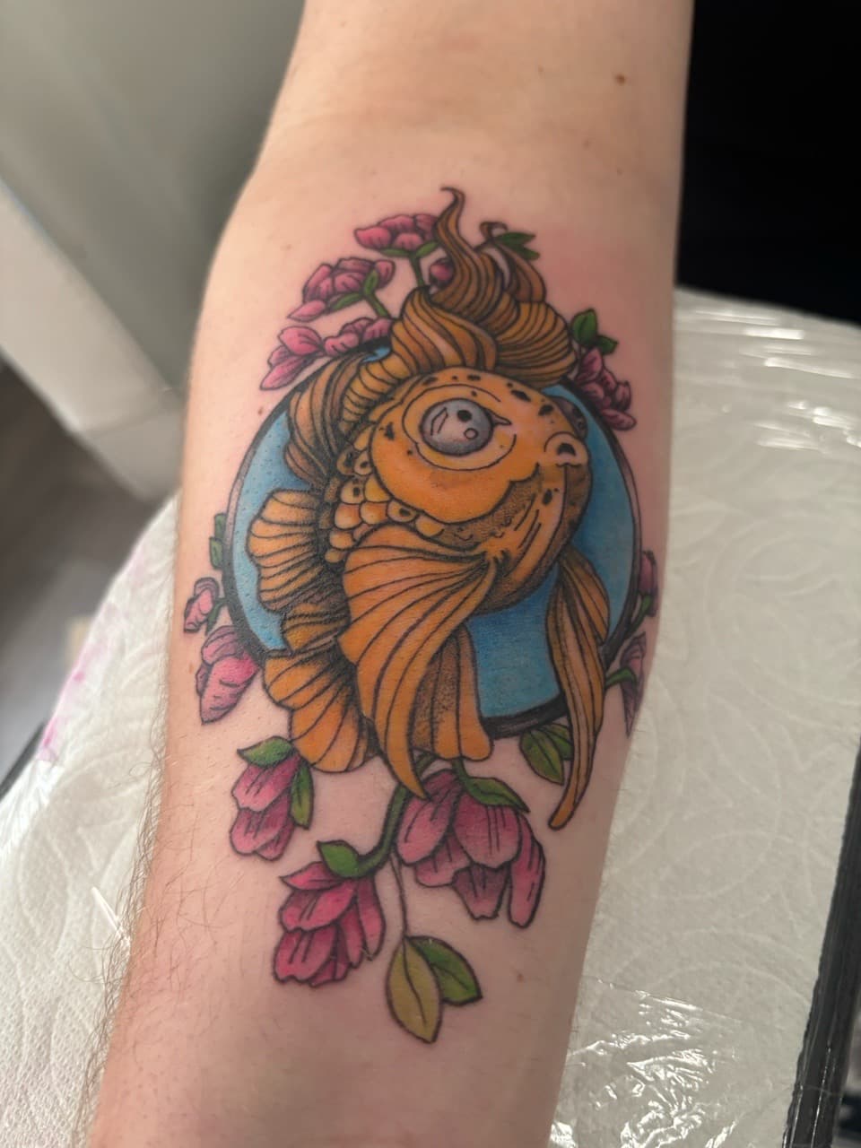 New School + Illustrative goldfish tattoo on Forearm by Skull_Brothers_Ink on TattMe