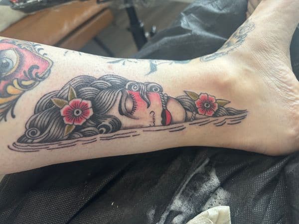 Traditional + American Traditional woman tattoo on Foot by Skull_Brothers_Ink on TattMe