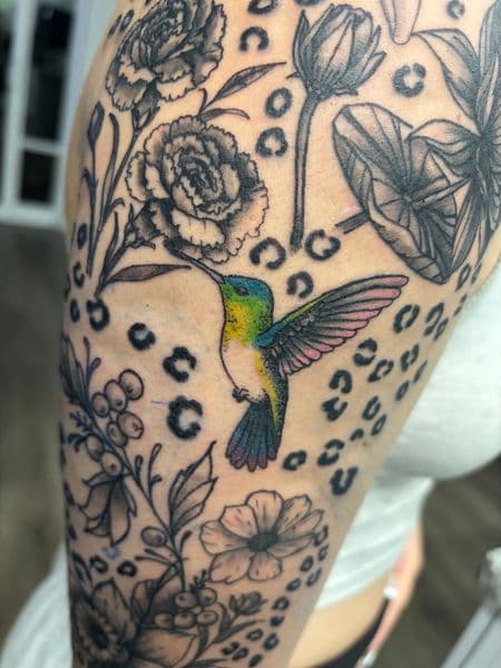 Floral + Color hummingbird tattoo on Upper Arm by Skull_Brothers_Ink on TattMe