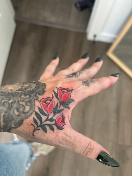 American Traditional + Color roses tattoo on Hand by Skull_Brothers_Ink on TattMe