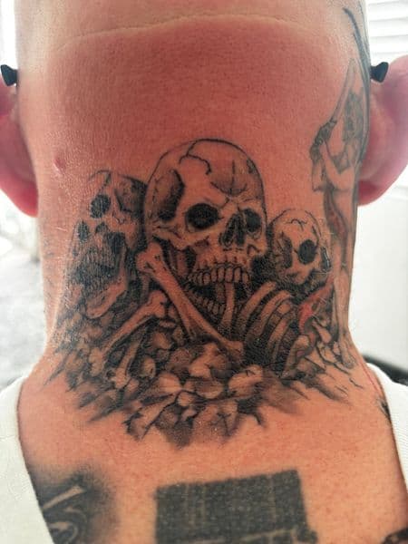 Black & Grey + Illustrative skulls tattoo on Neck (Back) by Skull_Brothers_Ink on TattMe