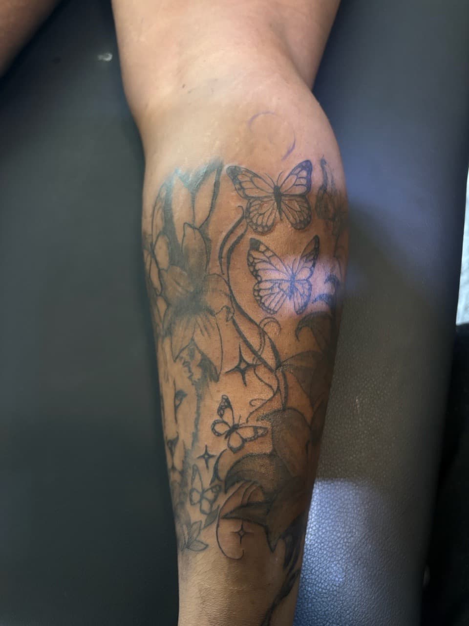 Black & Grey + Floral butterflies tattoo on Calf by SnapInk on TattMe