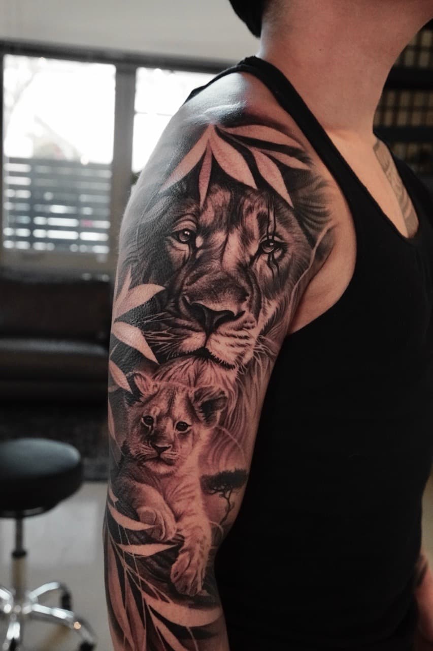 Black & Grey + Realism lion tattoo on Upper Arm by Devonne_Foxworth on TattMe