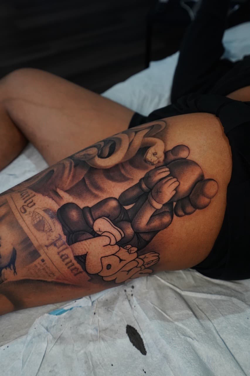Black & Grey + Illustrative kaws tattoo on Thigh by Devonne_Foxworth on TattMe