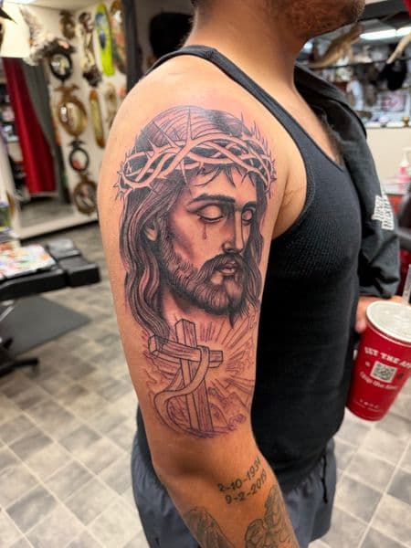 Black & Grey + Realism jesus tattoo on Upper Arm by Kneedeep_tattoos on TattMe