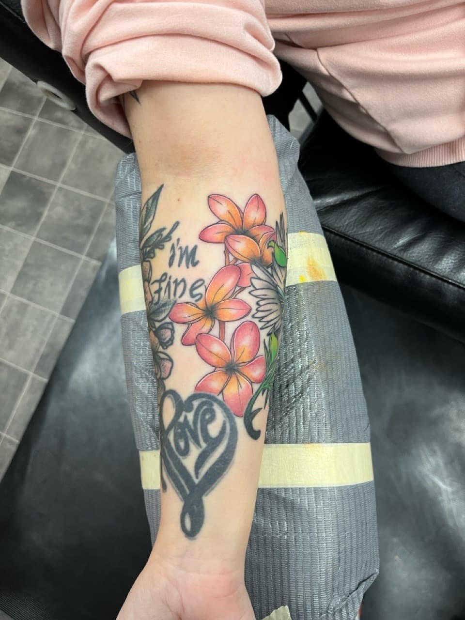 Floral + Lettering flowers tattoo on Forearm by Kneedeep_tattoos on TattMe