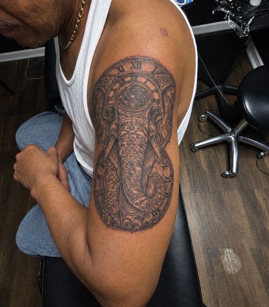 Black & Grey + Illustrative elephant tattoo on Upper Arm by dna_arts on TattMe