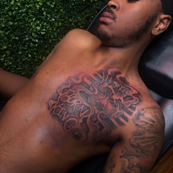 Black & Grey + Lettering lettering tattoo on Chest by RZ_ink on TattMe